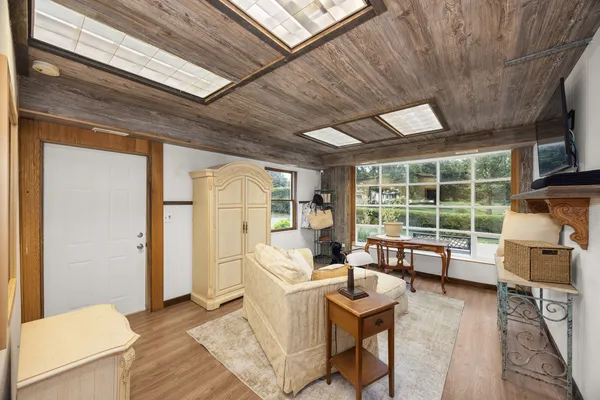 a living room with furniture and a window