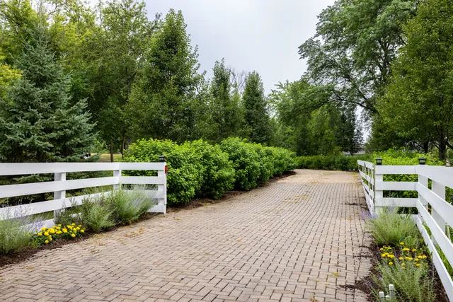 a view of backyard with outdoor seating and green space