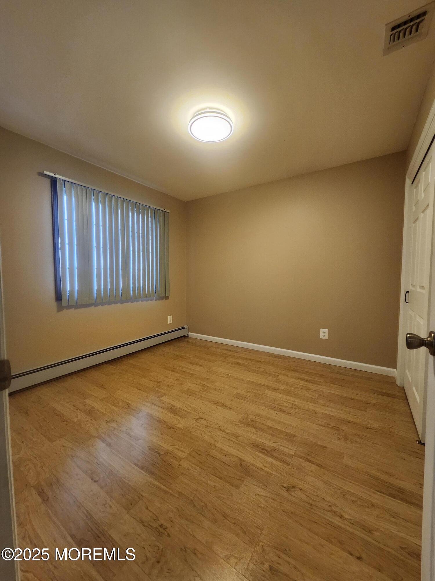 158 County Road Cliffwood, NJ 07721 - Photo 15 of 19 an empty room with a empty space and windows