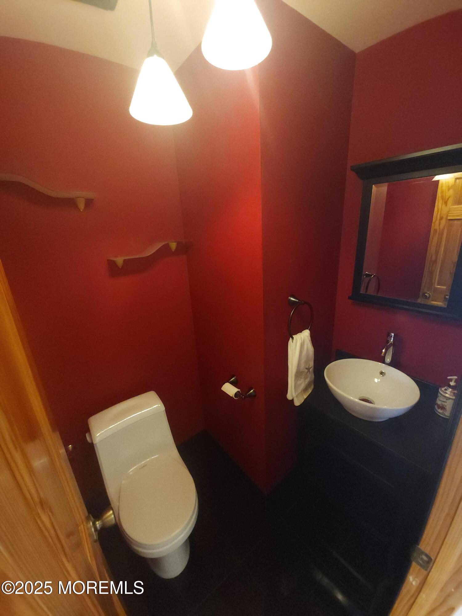 158 County Road Cliffwood, NJ 07721 - Photo 7 of 19 a bathroom with a toilet sink and mirror