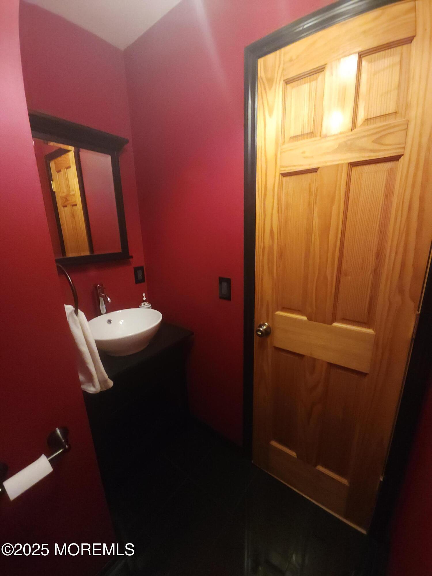 158 County Road Cliffwood, NJ 07721 - Photo 8 of 19 a bathroom with a sink a mirror and a toilet