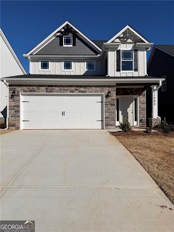 a front view of a house with garage