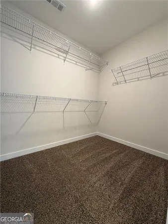 a view of a room with racks on the wall