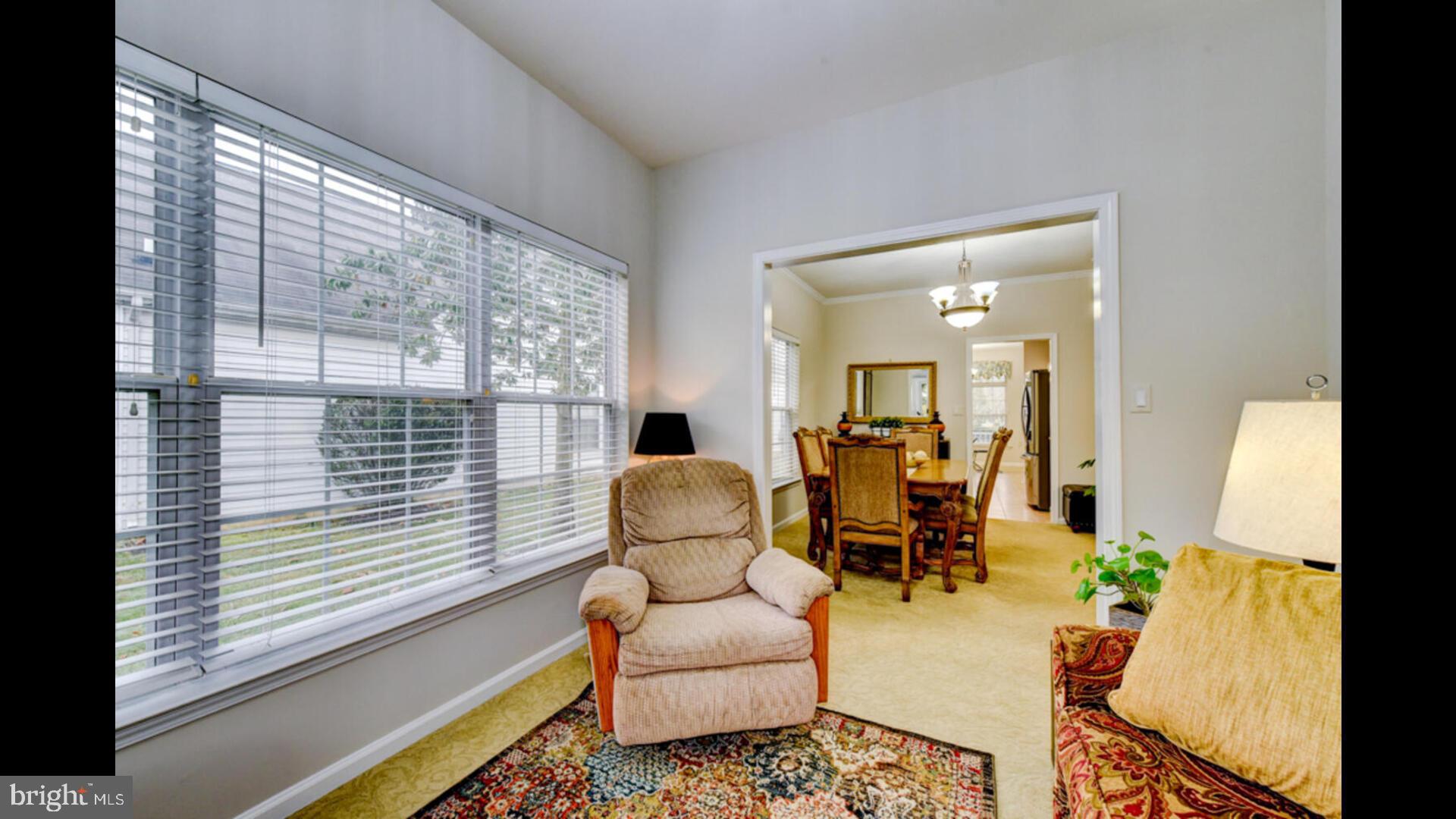 25 Cardinal Flower Lane Princeton Junction, NJ 08550 - Photo 17 of 54 a living room with furniture and a large window