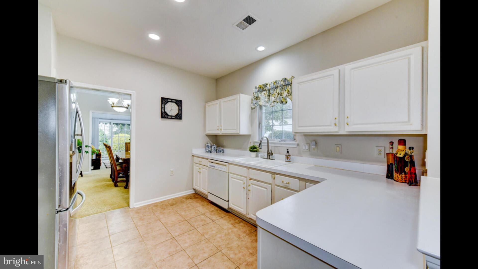25 Cardinal Flower Lane Princeton Junction, NJ 08550 - Photo 18 of 54 a kitchen with white cabinets and sink
