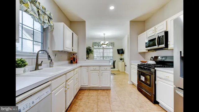 a kitchen with white cabinets