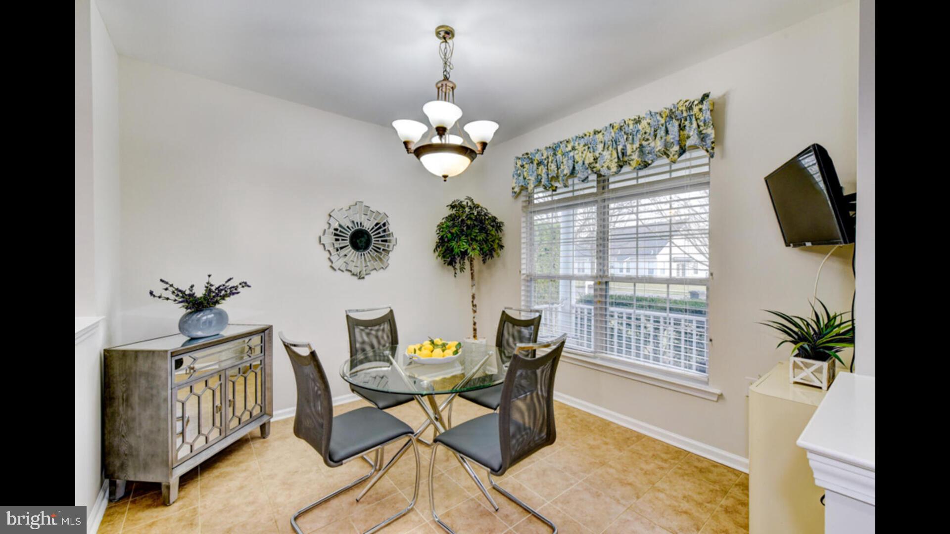 25 Cardinal Flower Lane Princeton Junction, NJ 08550 - Photo 22 of 54 a view of a dining room with furniture wooden floor and chandelier