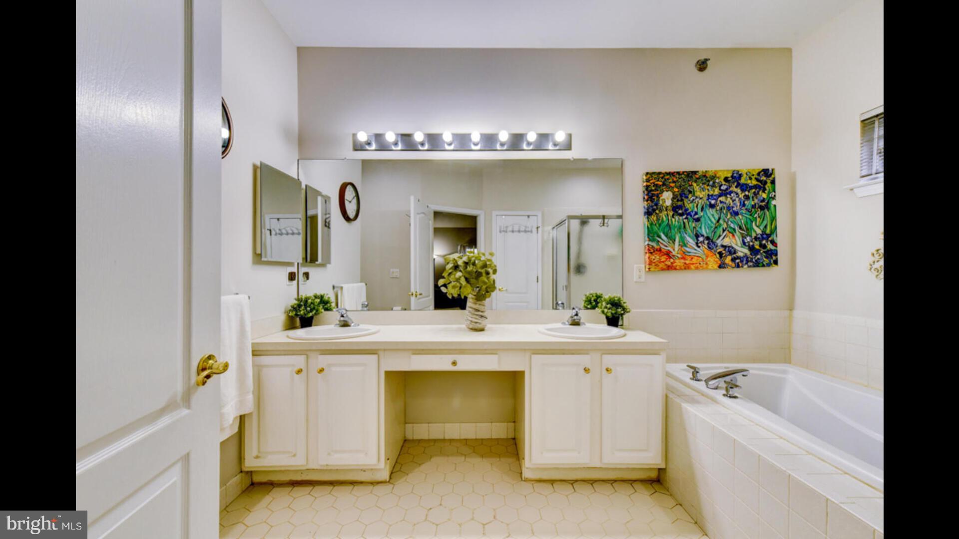 25 Cardinal Flower Lane Princeton Junction, NJ 08550 - Photo 25 of 54 a spacious bathroom with a tub sink and mirror