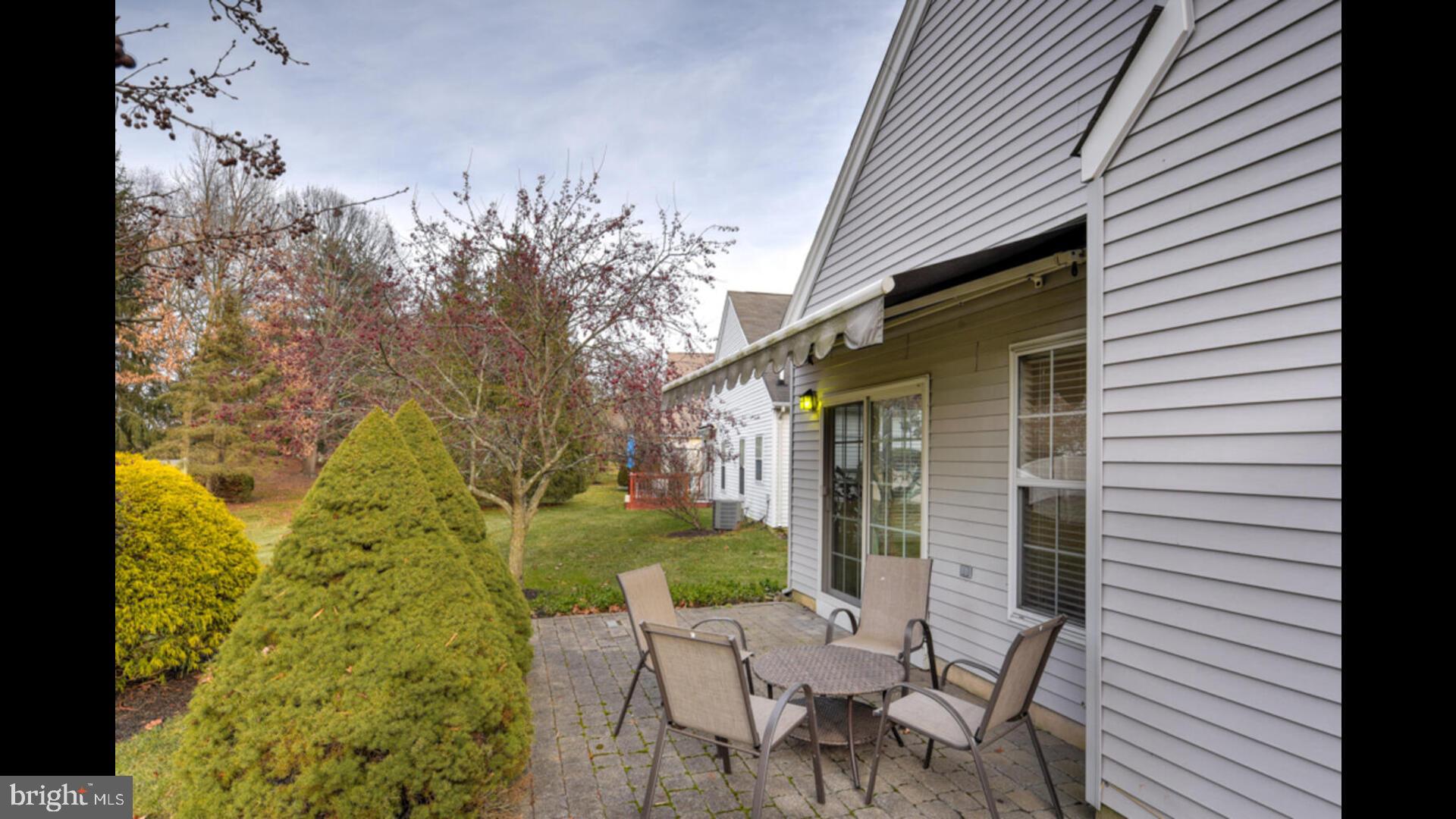 25 Cardinal Flower Lane Princeton Junction, NJ 08550 - Photo 32 of 54 a view of a chair and table in backyard of the house