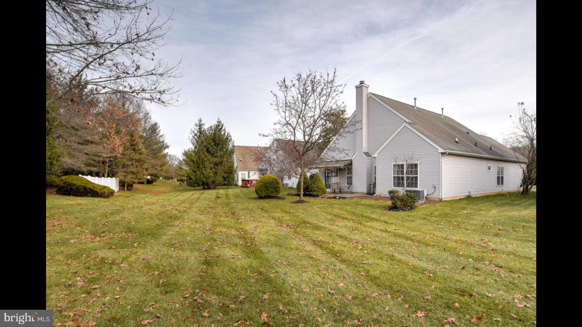 25 Cardinal Flower Lane Princeton Junction, NJ 08550 - Photo 35 of 54 a view of a house with backyard and trees
