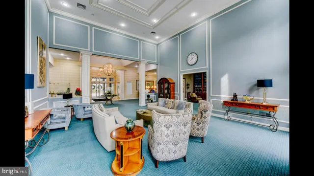 a living room with stainless steel appliances kitchen island granite countertop furniture and a kitchen view