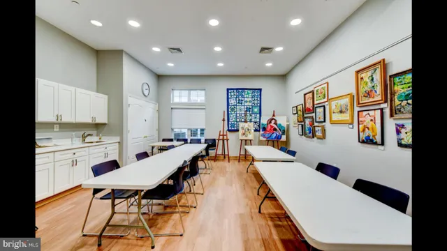 a view of house with yard and car parked