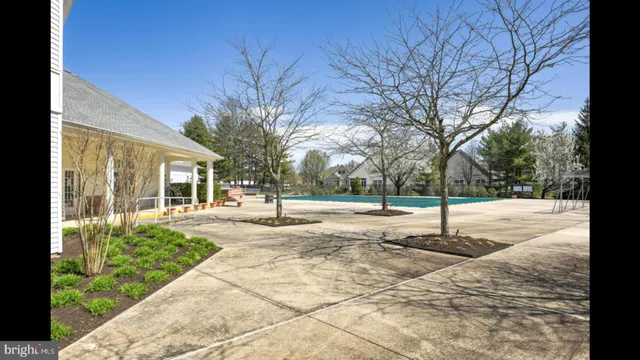 a view of a swimming pool with an outdoor space and seating area