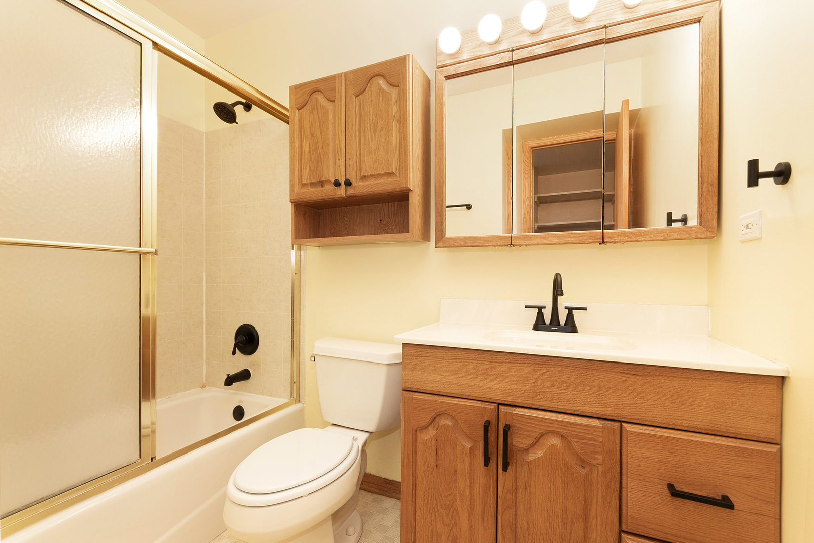 1635 Chippendale Road Hoffman Estates, IL 60169 - Photo 13 of 27 a bathroom with a sink a toilet and shower