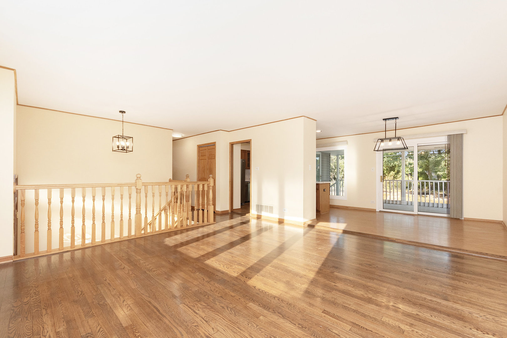 1635 Chippendale Road Hoffman Estates, IL 60169 - Photo 3 of 27 a view of an empty room with wooden floor