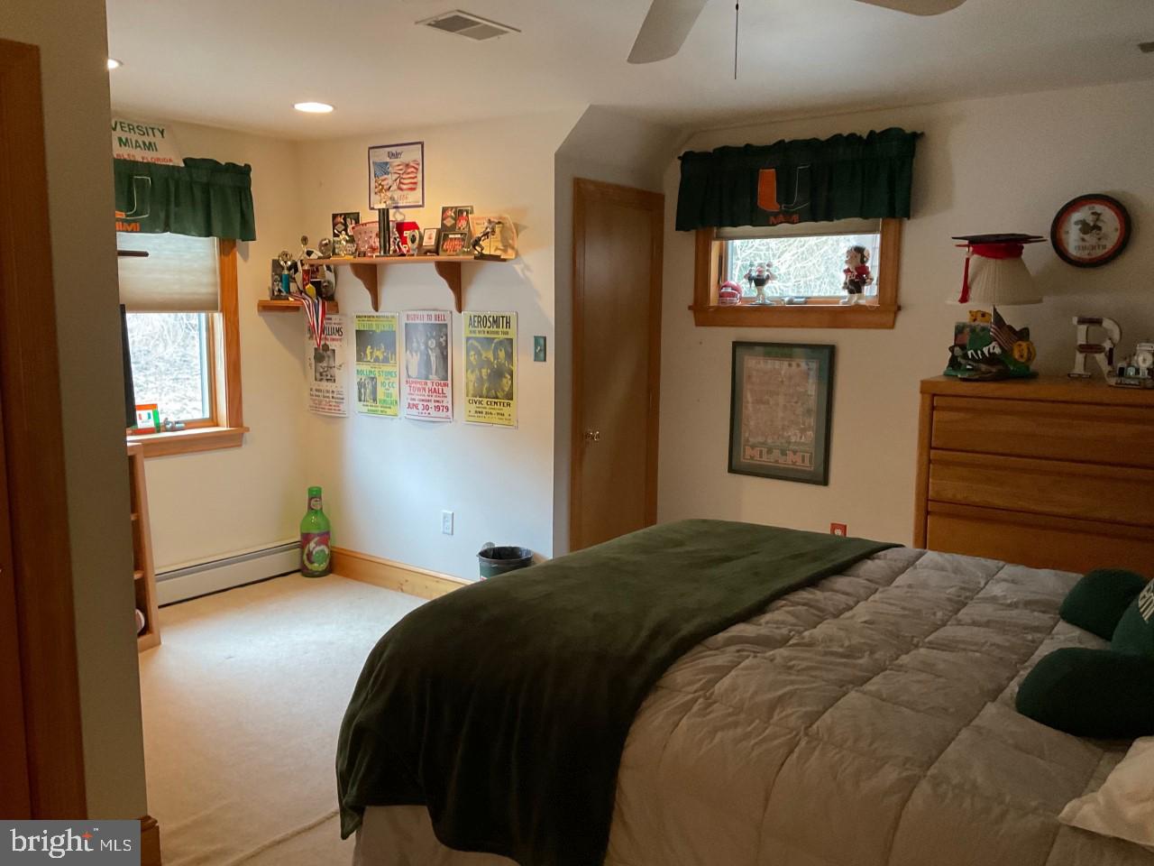 791 Temple Road Pottstown, PA 19465 - Photo 40 of 82 a bedroom with a bed and a wall painting