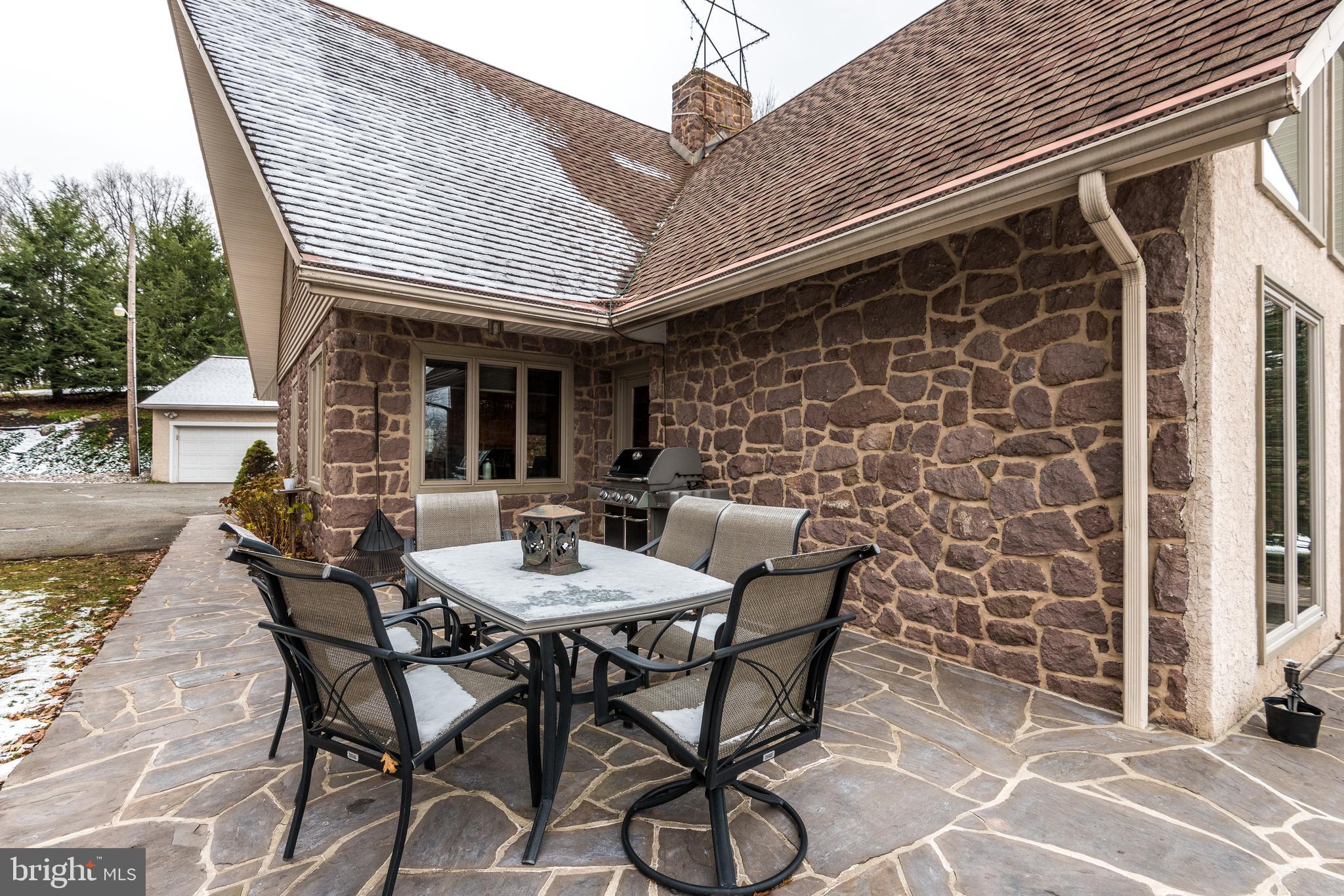 791 Temple Road Pottstown, PA 19465 - Photo 69 of 82 a view of a patio with table and chairs and potted plants