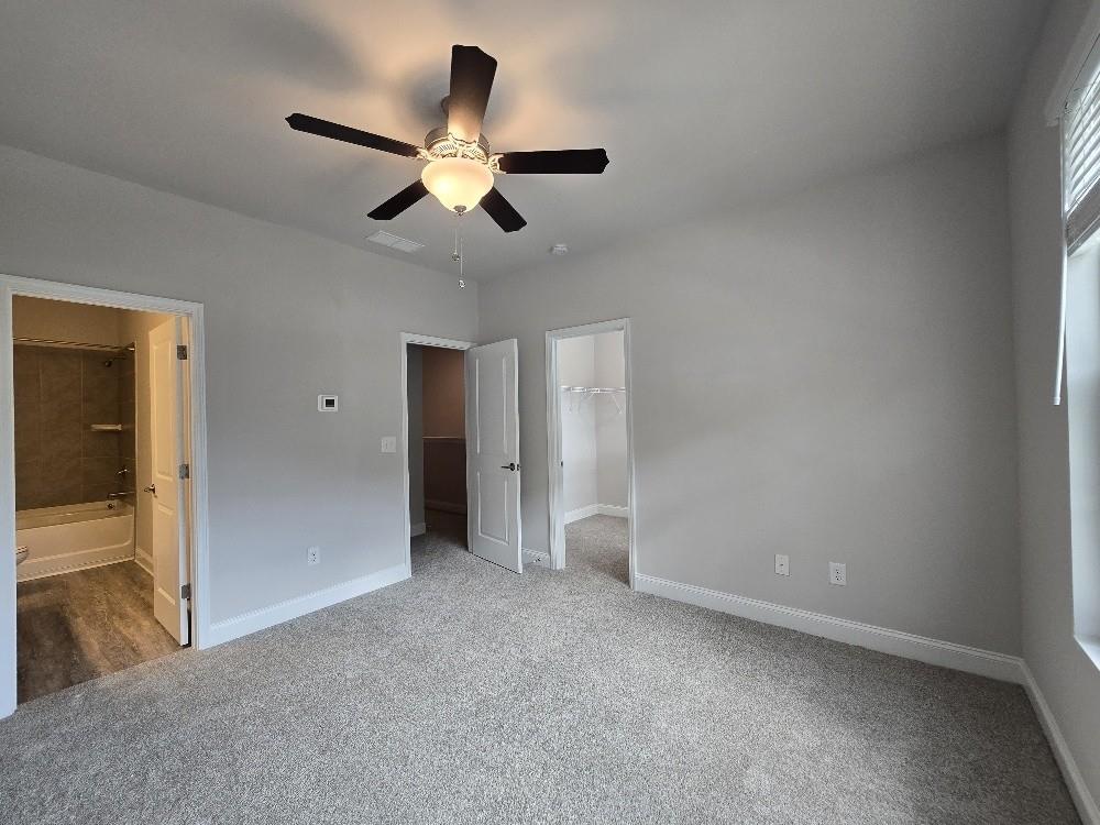 6206 Ripple Way, Unit 89 Atlanta, GA 30349 - Photo 19 of 26 an empty room with closet and wooden floor