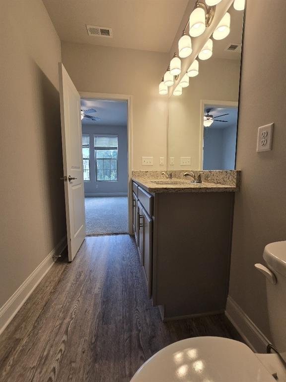 6206 Ripple Way, Unit 89 Atlanta, GA 30349 - Photo 23 of 26 a bathroom with a sink a toilet and mirror
