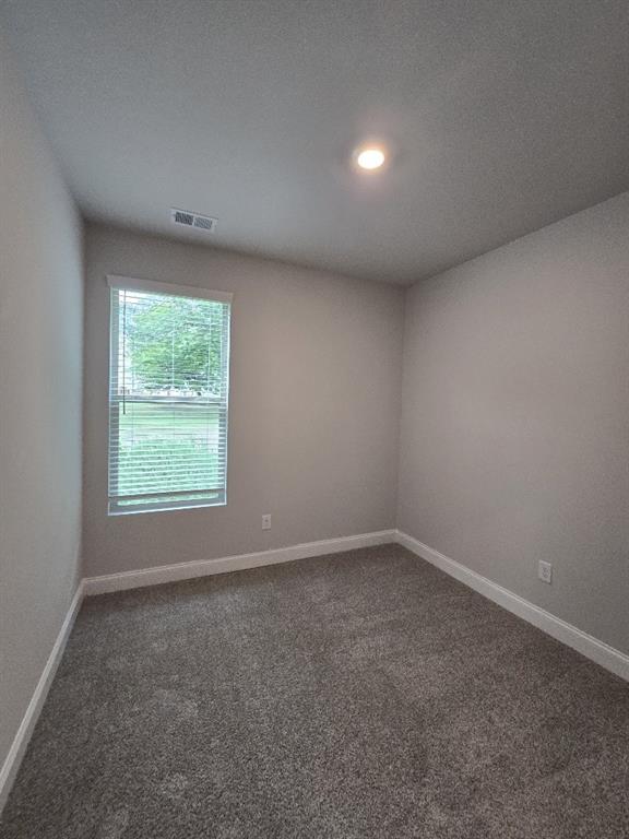 6206 Ripple Way, Unit 89 Atlanta, GA 30349 - Photo 25 of 26 an empty room with a window
