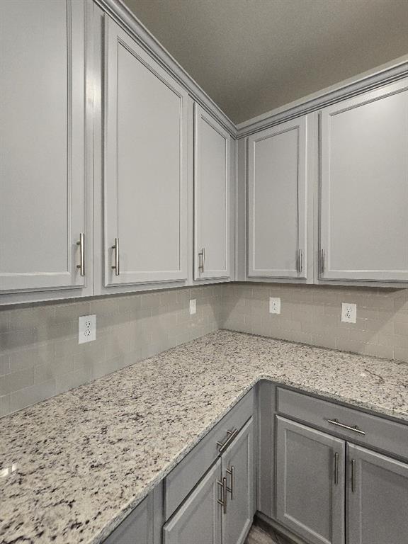 6206 Ripple Way, Unit 89 Atlanta, GA 30349 - Photo 9 of 26 a kitchen with granite countertop a sink and cabinets