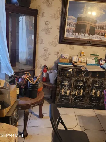 a view of a chairs and table in a backyard