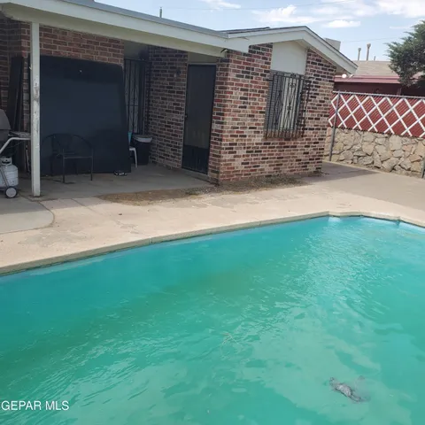 a backyard of a house with seating space