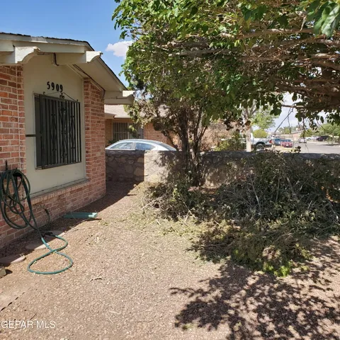 a view of a backyard of the house