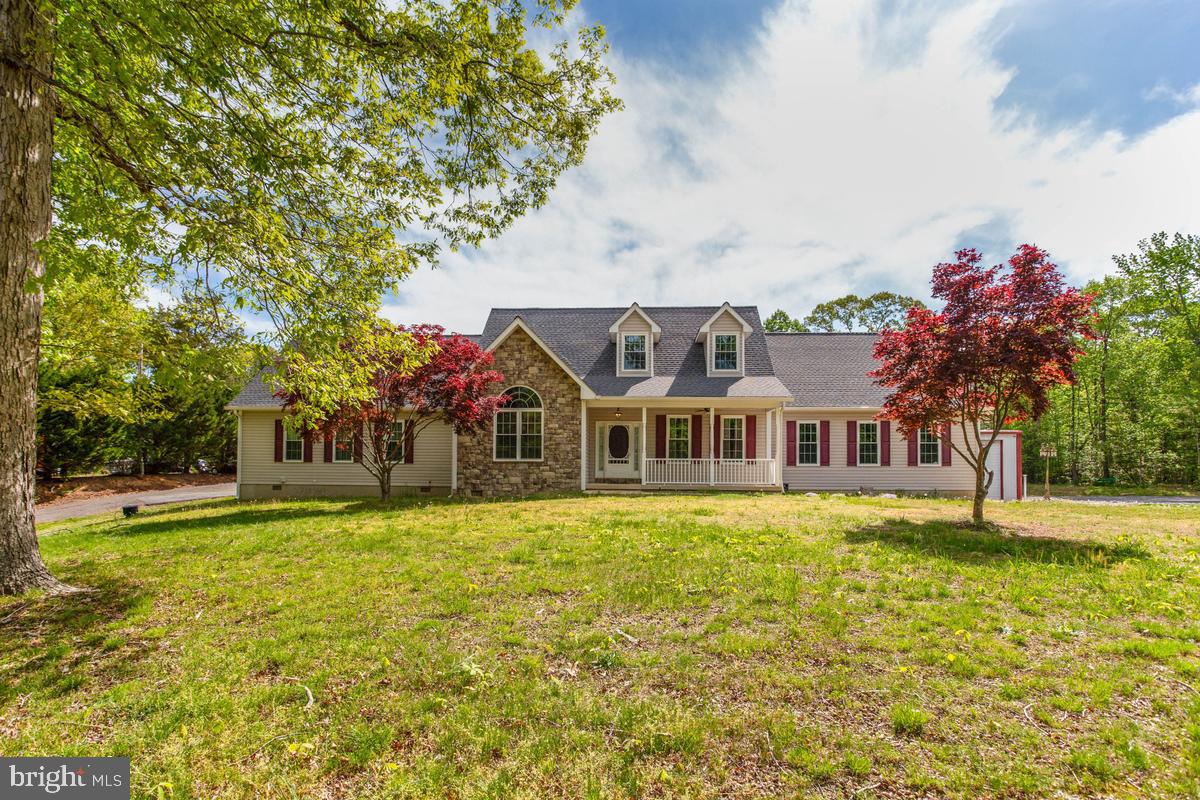 400 Adelina Road Prince Frederick, MD 20678 - Photo 1 of 57 Charming home with lush greenery.