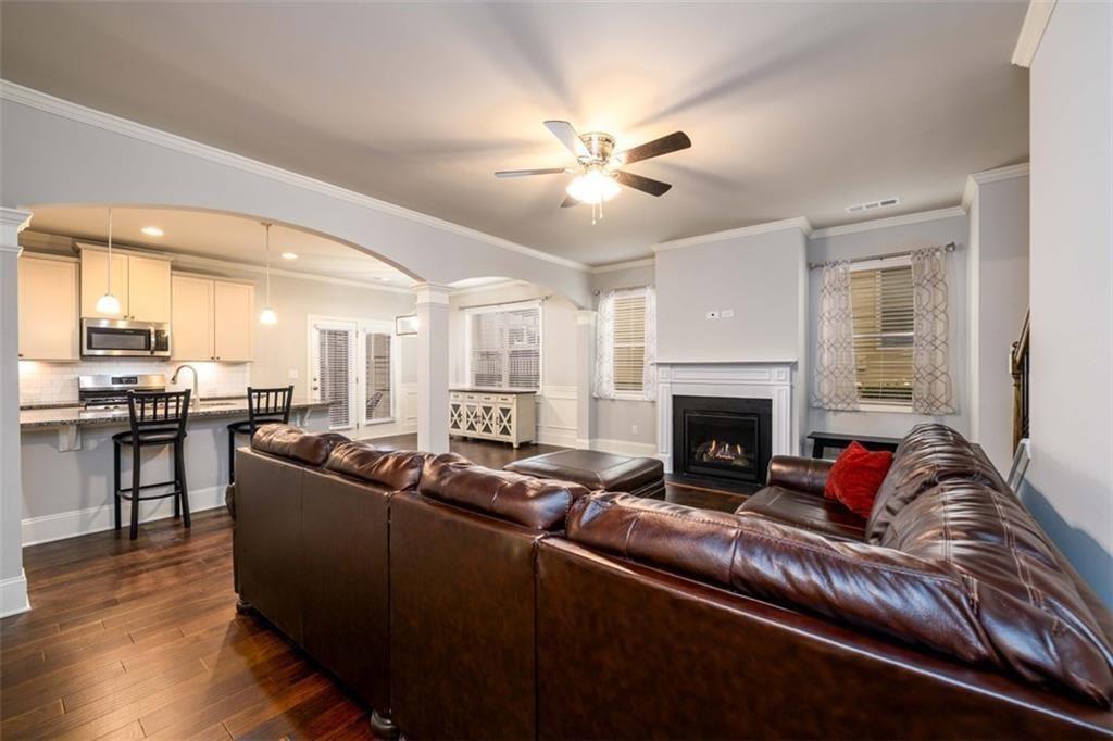 6622 Trailblazer Road Flowery Branch, GA 30542 - Photo 17 of 51 a living room with furniture and a fireplace