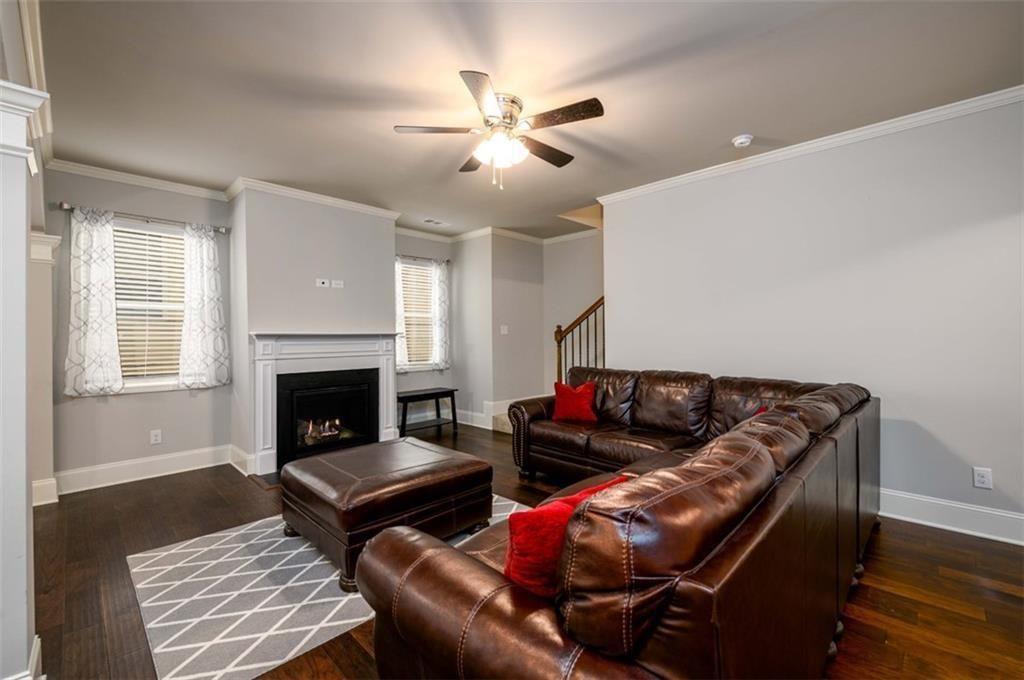 6622 Trailblazer Road Flowery Branch, GA 30542 - Photo 18 of 51 a living room with furniture and a fireplace