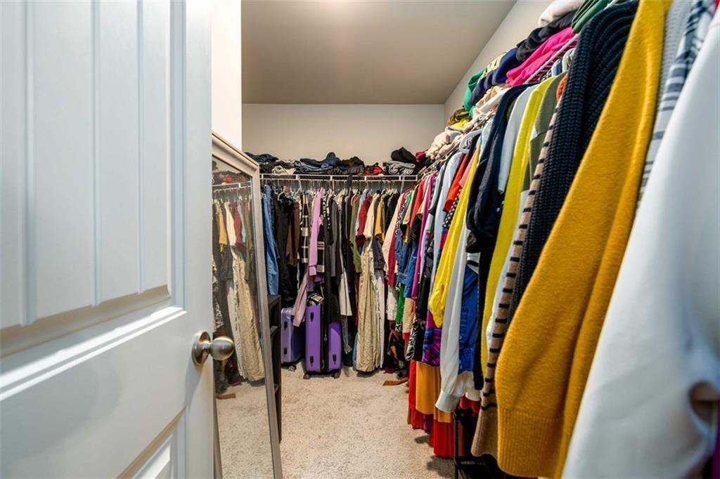 6622 Trailblazer Road Flowery Branch, GA 30542 - Photo 24 of 51 a view of walk in closet with clothes