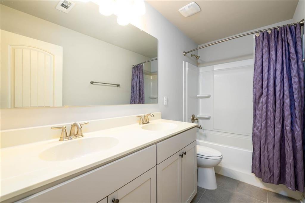 6622 Trailblazer Road Flowery Branch, GA 30542 - Photo 33 of 51 a bathroom with a sink toilet and shower