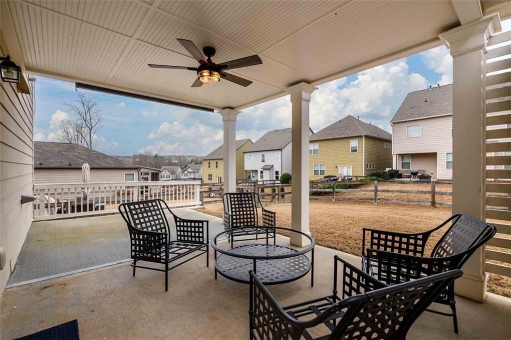 6622 Trailblazer Road Flowery Branch, GA 30542 - Photo 34 of 51 a room with lots of furniture and white walls