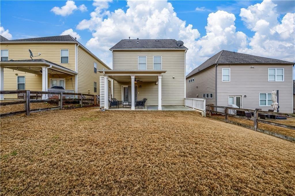 6622 Trailblazer Road Flowery Branch, GA 30542 - Photo 38 of 51 a front view of a house with a yard