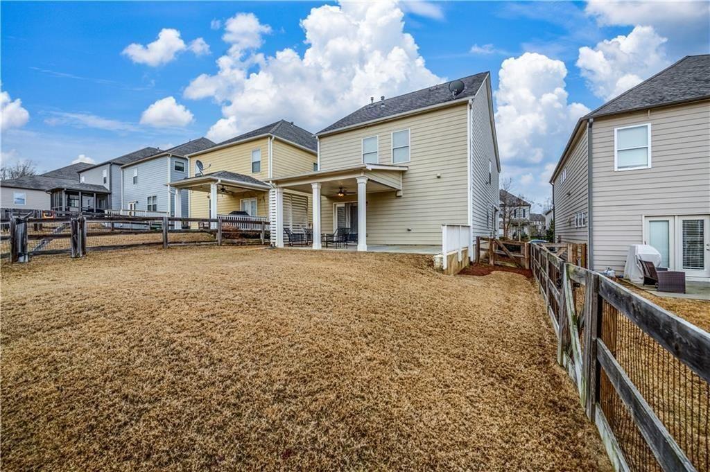6622 Trailblazer Road Flowery Branch, GA 30542 - Photo 39 of 51 a view of a house with a patio