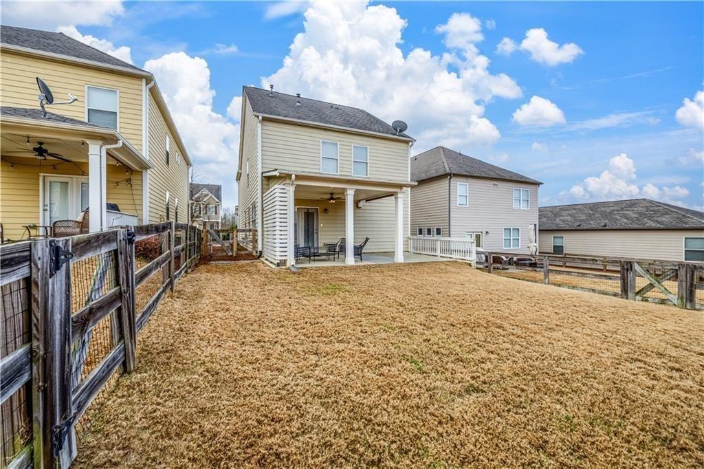 6622 Trailblazer Road Flowery Branch, GA 30542 - Photo 40 of 51 a view of a house with a yard