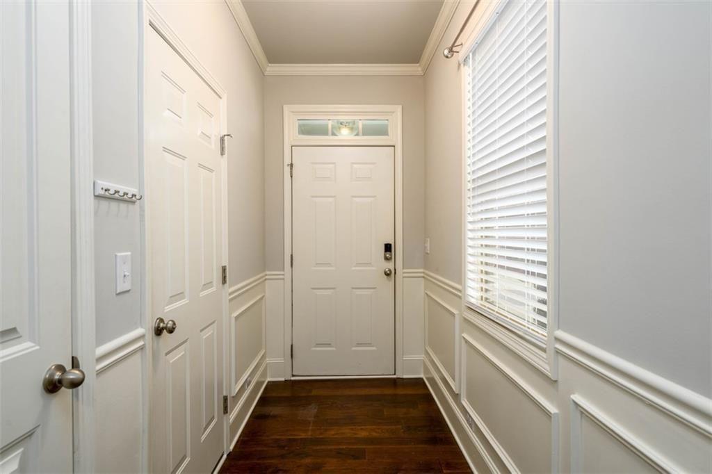 6622 Trailblazer Road Flowery Branch, GA 30542 - Photo 6 of 51 a view of a hallway with a white walls and a window