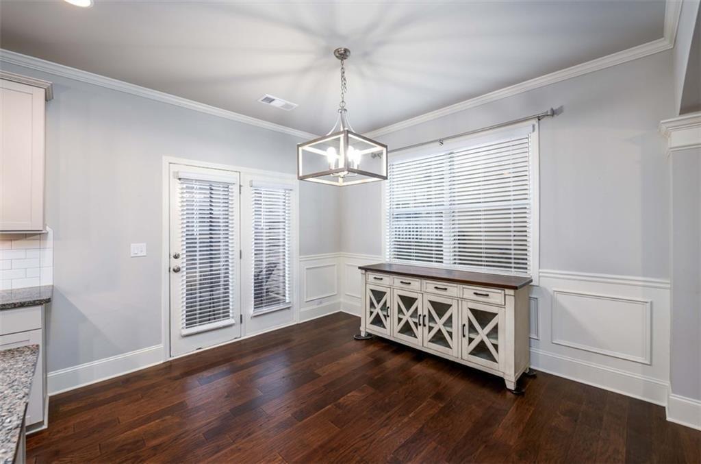 6622 Trailblazer Road Flowery Branch, GA 30542 - Photo 8 of 51 a view of a room with wooden floor windows and couch