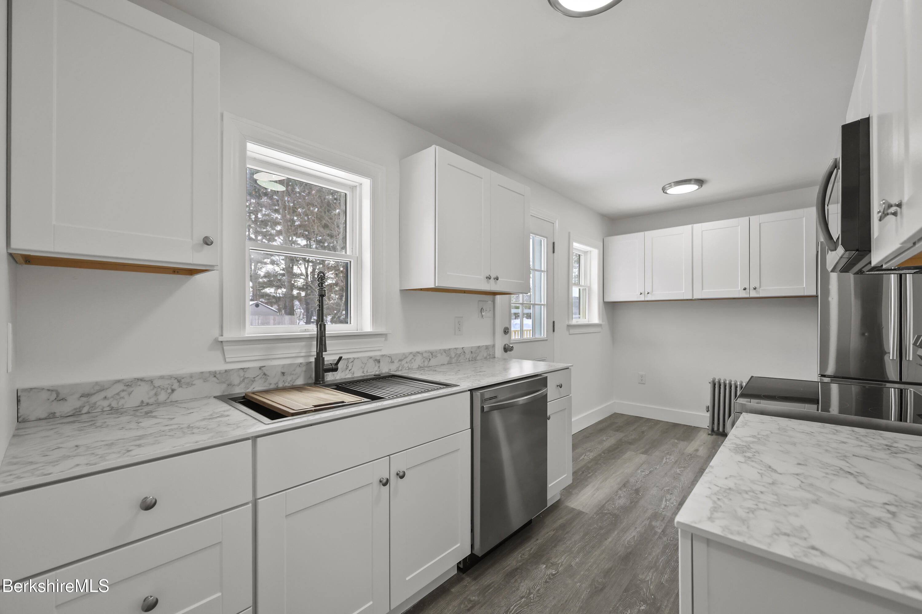 1990 East Street Pittsfield, MA 01201 - Photo 11 of 33 a kitchen with a sink stove and cabinets