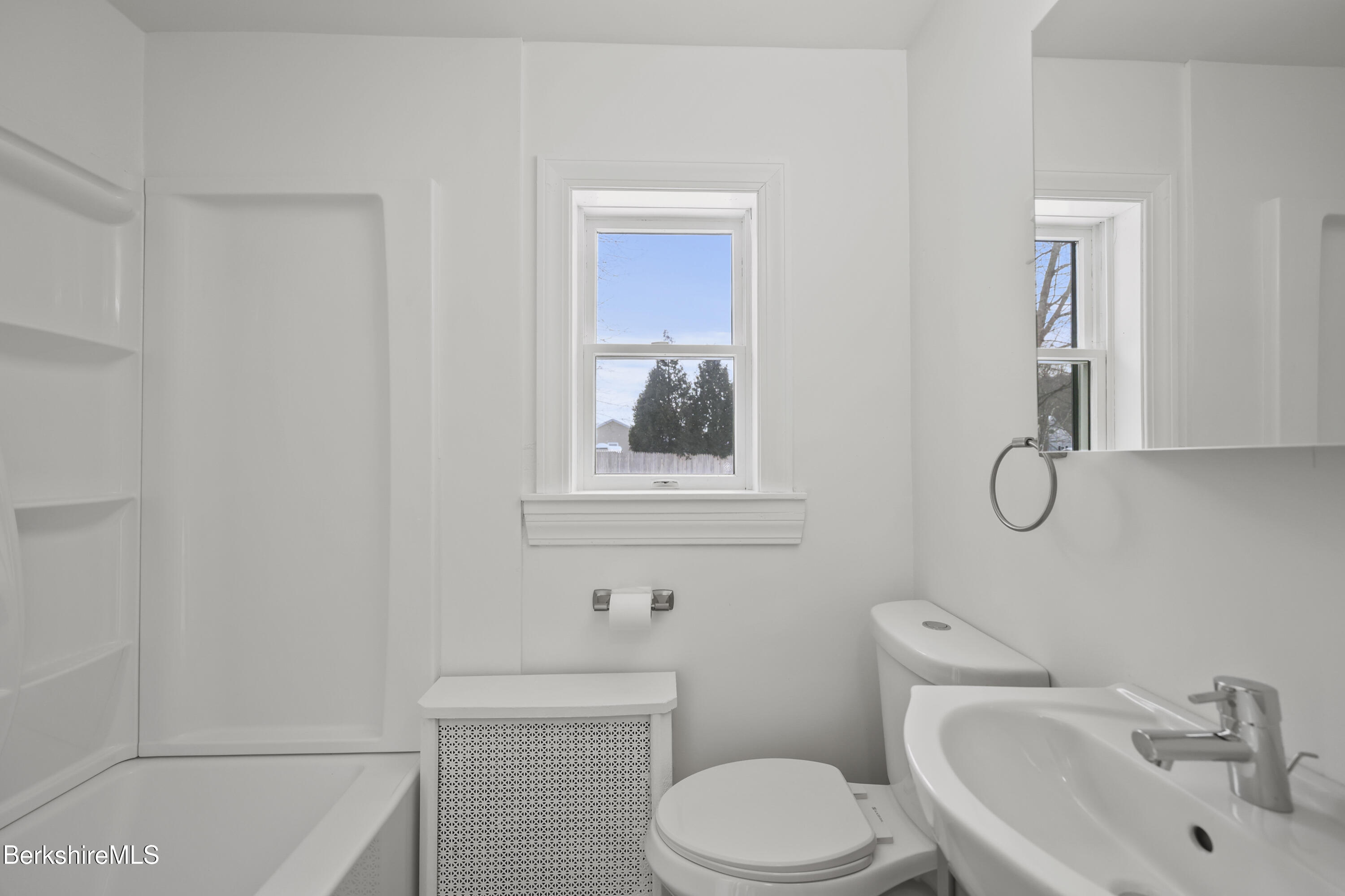 1990 East Street Pittsfield, MA 01201 - Photo 17 of 33 a white toilet sitting next to a bathroom sink