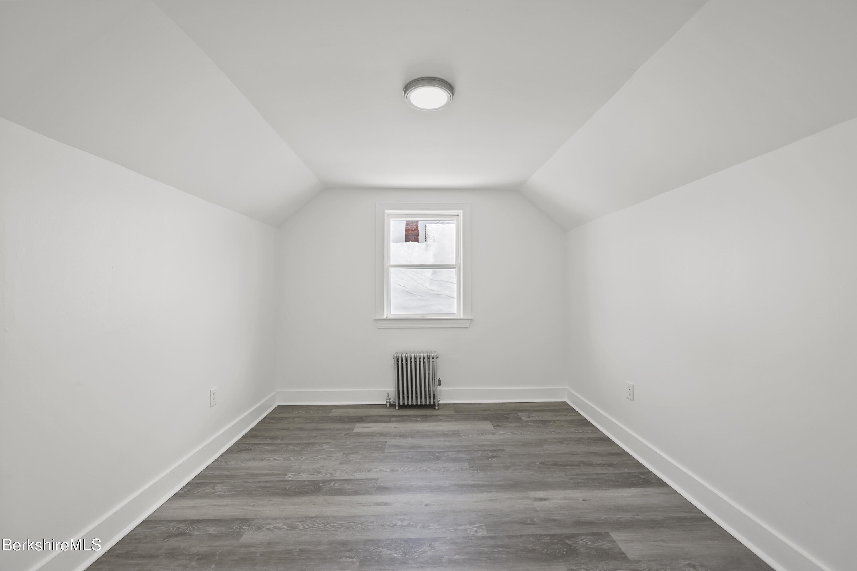 1990 East Street Pittsfield, MA 01201 - Photo 21 of 33 a view of empty room with wooden floor and fan