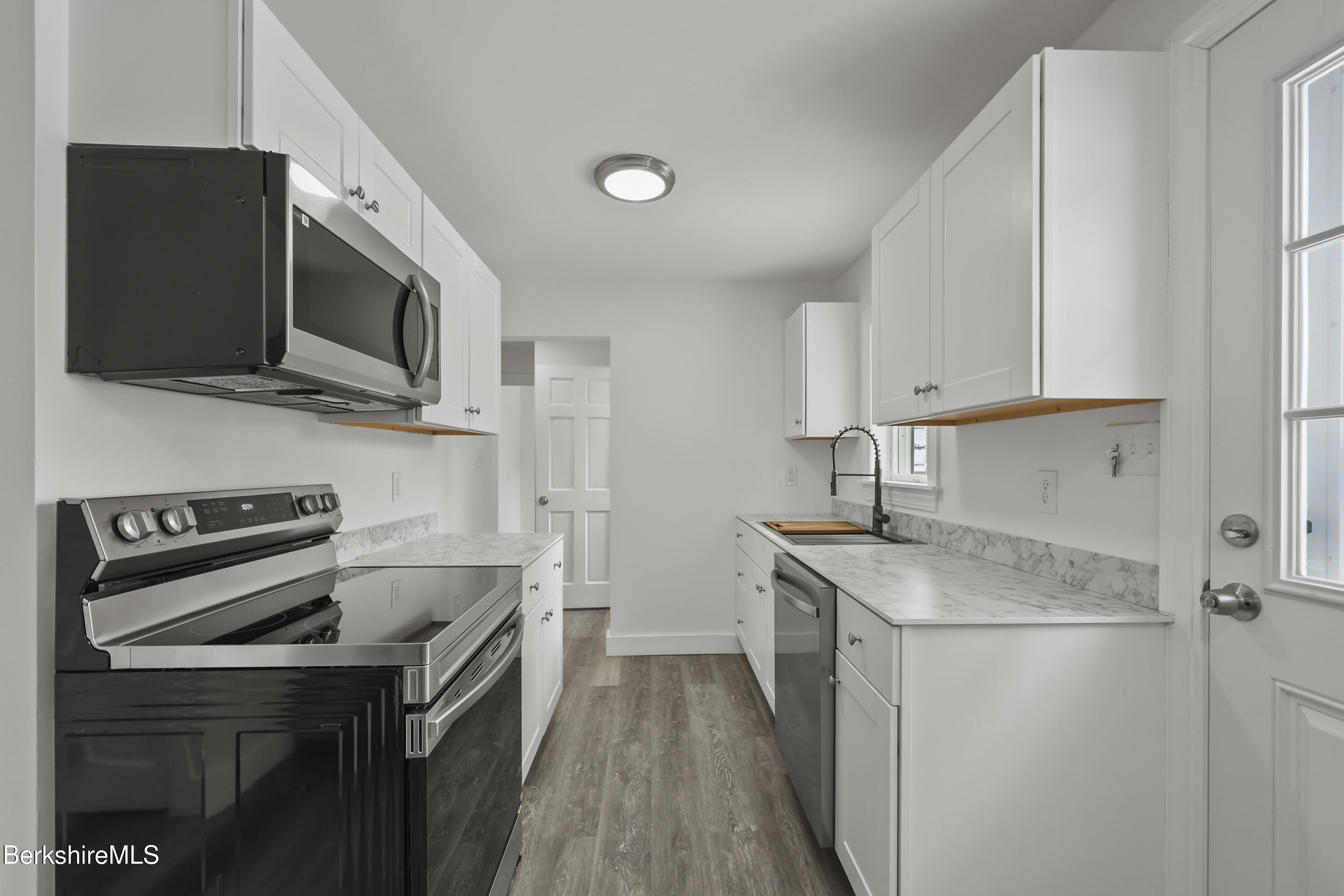 1990 East Street Pittsfield, MA 01201 - Photo 7 of 33 a kitchen with a sink stove and microwave