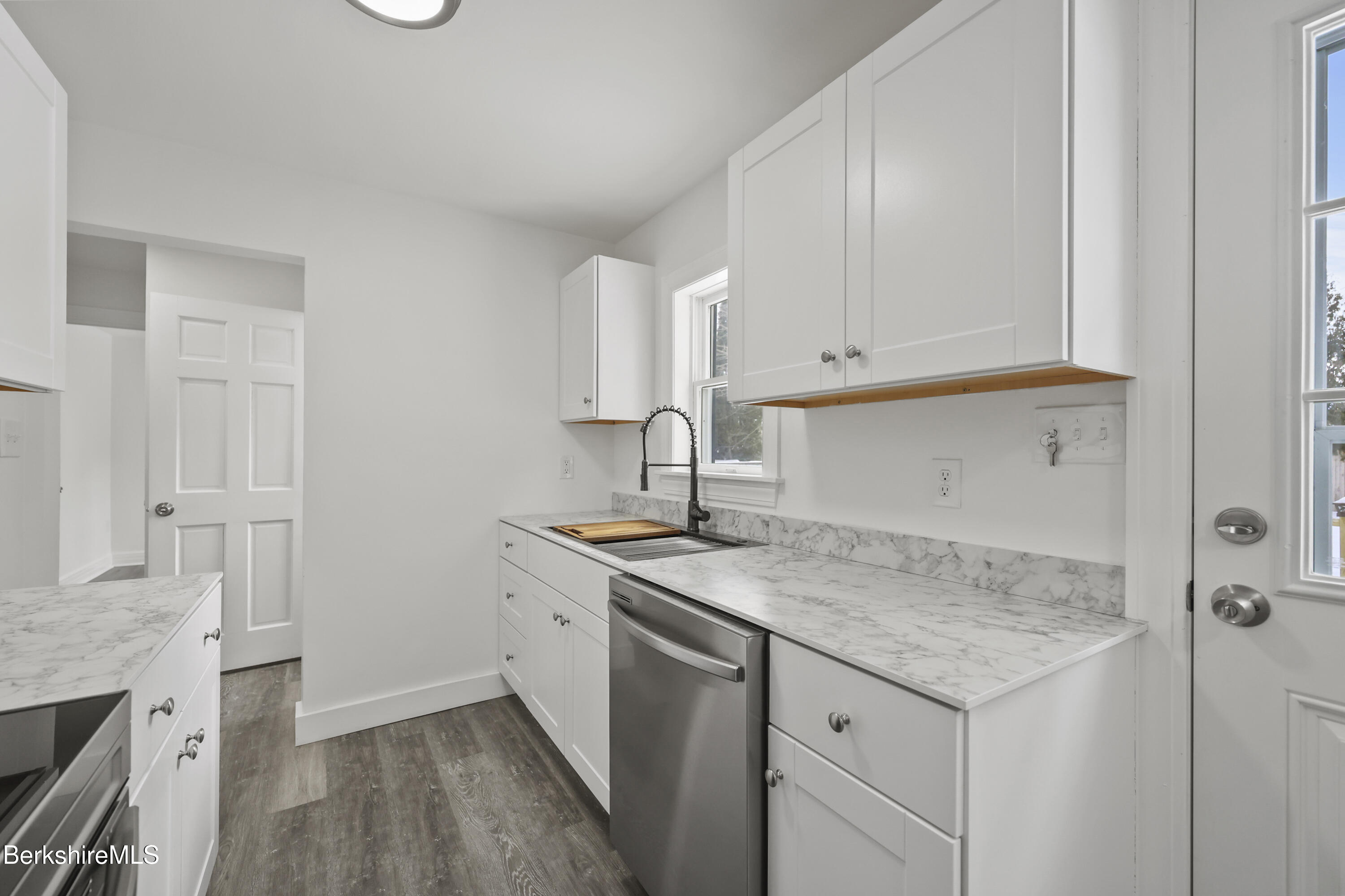 1990 East Street Pittsfield, MA 01201 - Photo 8 of 33 a kitchen with a sink cabinets and wooden floor