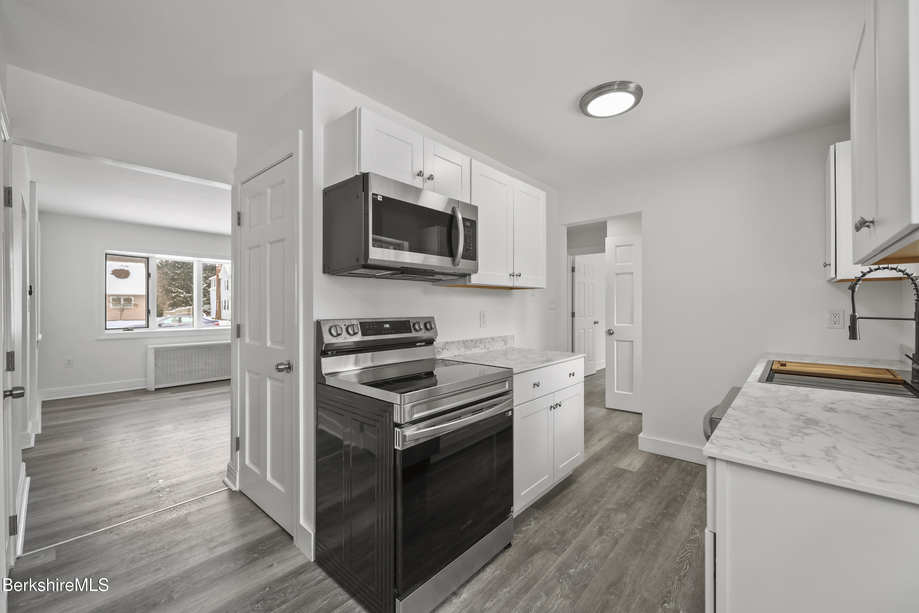 1990 East Street Pittsfield, MA 01201 - Photo 9 of 33 a kitchen with a stove sink and microwave