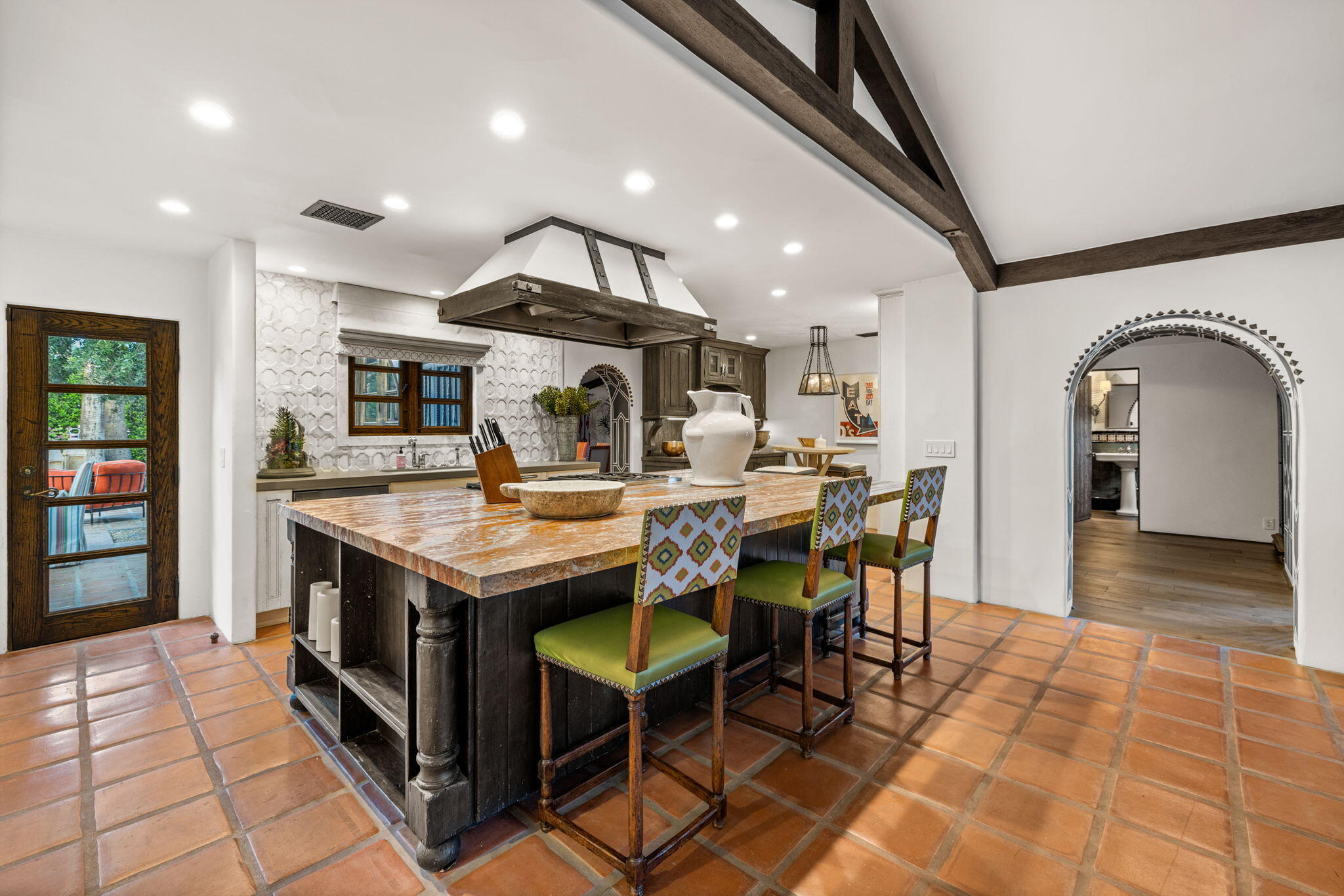 535 North Belardo Road Palm Springs, CA 92262 - Photo 12 of 45 a kitchen with stainless steel appliances granite countertop a table chairs and a refrigerator