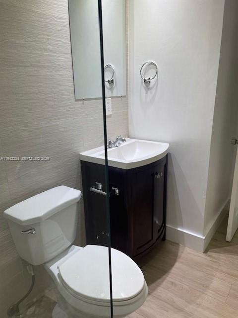 219 Southwest 9th Avenue, Unit 2 Miami, FL 33130 - Photo 14 of 28 a bathroom with a sink a toilet a mirror and vanity