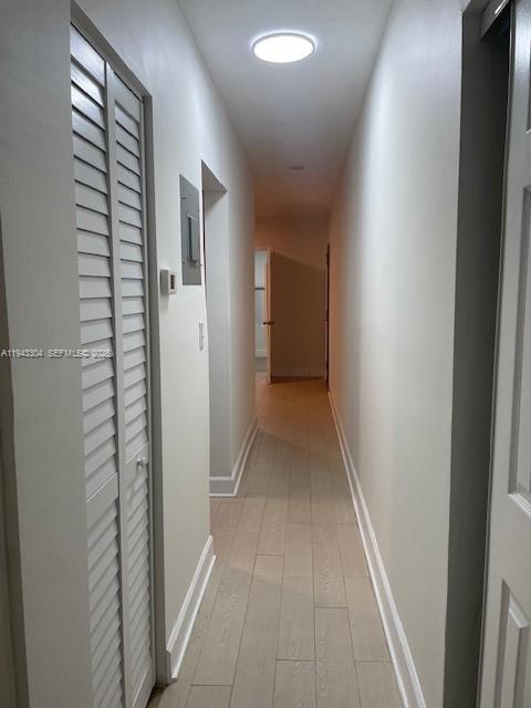 219 Southwest 9th Avenue, Unit 2 Miami, FL 33130 - Photo 20 of 28 a view of a hallway with wooden floor and a bathroom