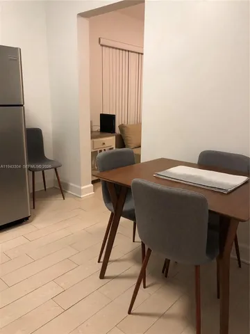 a work place with furniture and a window