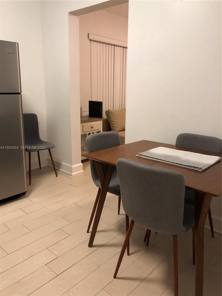 219 Southwest 9th Avenue, Unit 2 Miami, FL 33130 - Photo 6 of 28 a work place with furniture and a window